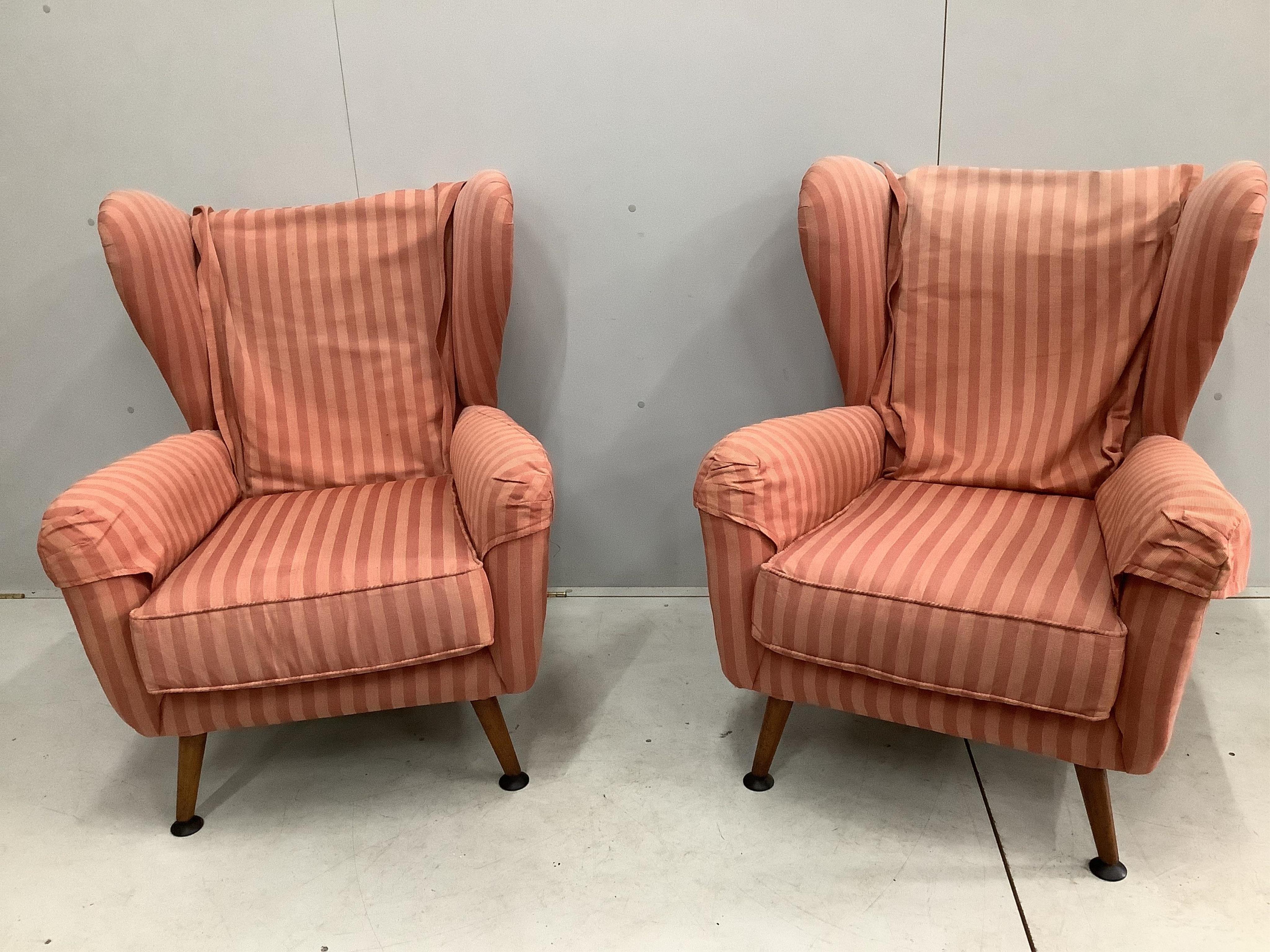 A pair of Bambino style upholstered wing armchairs, width 76cm, depth 71cm, height 99cm. Condition - fair, upholstery faded